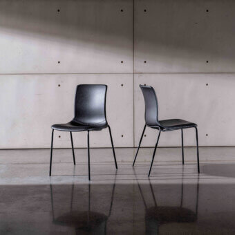 Superior Sovet Italia Olly chair in black with a smooth matte finish and curved backrest built with a metal base