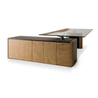 Executive desk with light brown wood cabinet, dark brown base, and clear glass tabletop supported by cylindrical metal legs.