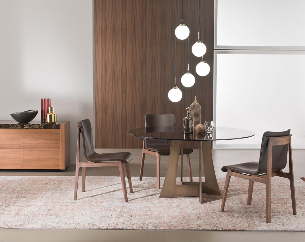 Distinguished 4 Mariani Babette chair with articulated wood frame upholstered in supple leather and medium-brown finish
