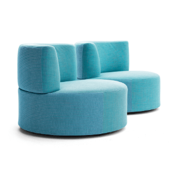 Modular lounge chair, turquoise corduroy fabric, rounded dual-section design with stacked cushions and circular seat, studio shot.