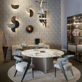 Elegant Bizzotto Italia Plume table with ash gray base and marble-effect top displaying ivory, copper, bronze geometric streaks