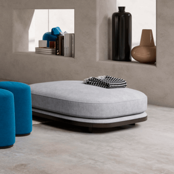 Exceptional CPRN Homood Pierre ottoman upholstered in light gray woven textile with a recessed base