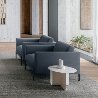 Elegant LaCividina Newtime lounge chair with dark blue textile upholstery and slim metal feet