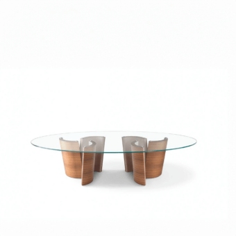 Distinguished OAK Madison table with clear glass top and warm medium-brown curved wooden bases in matte finish
