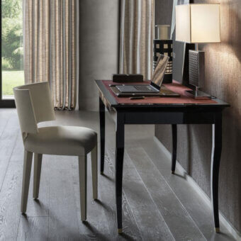Sophisticated OAK Nolita chair with geometric lines and enveloping backrest upholstered in light gray textile with matte finish