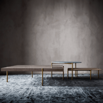 Distinguished OAK Ritmo coffee table with rectangular wood top and slender gold-colored painted metal legs in textured matte finish