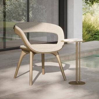 Exceptional Reflex Nido armchair with bronze metallic shell and legs, upholstered in light beige textile