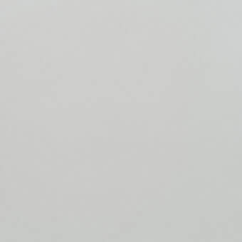 Pale gray granular texture, cool neutral tone, uniform matte surface, diffused lighting, minimalist composition, consistent visual structure.