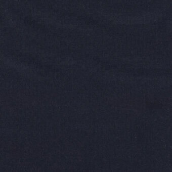 Dark blue woven fabric texture with a matte finish, displaying a uniform grain and saturated navy color, evenly lit with diffused light.