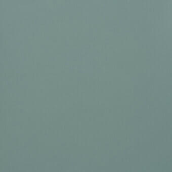 Dusty teal texture sample with a matte finish, displaying subtle tonal variations and a woven structure, labeled “810 turchese”.