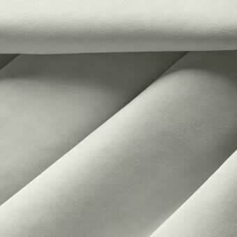 Gray fabric texture with overlapping curved forms, soft matte finish, and subtle “nk ghiaccio” text in the lower right corner.