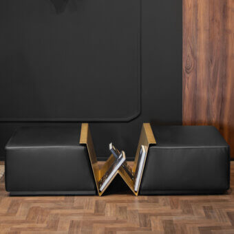 Distinguished Wayne Enterprises WE-158 ottoman with black leather cushions and gilded V-shaped metal rack crafted in Italy