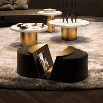 Exclusive WAYNE Enterprises WE-158 ottoman upholstered in dark plush fabric with integrated gold-toned metal magazine rack crafted in Italy