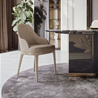 Elegant Bizzotto Italia Dune chair with light beige leather and lacquered metal legs crafted in a curved silhouette