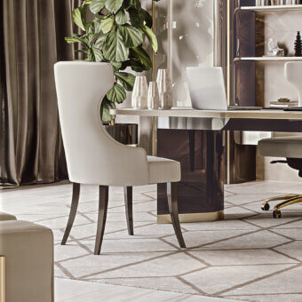Elegant Bizzotto Italia Hug chair with light beige leather and lacquered metal legs exhibits curved lines