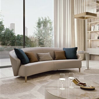 Elegant Bizzotto Italia Wave sofa upholstered in smooth light beige textile with lacquered metal legs and curated throw cushions