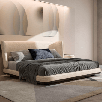 Marais bed, beige upholstered platform with curved headboard, gray pillows and throw, neutral rug, concentric circle wall panel.