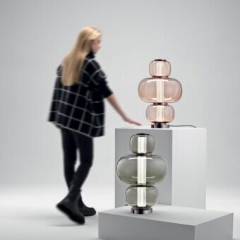 Distinguished Italamp Nube lamp with a grey glass structure surrounding a hand-carved crystal diffuser and iron grey metal finish