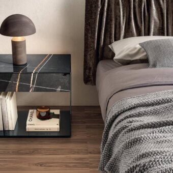 Innovative Lago UpGlass nightstand with tempered glass frame and black marble XGlass top exhibiting white and gold veining