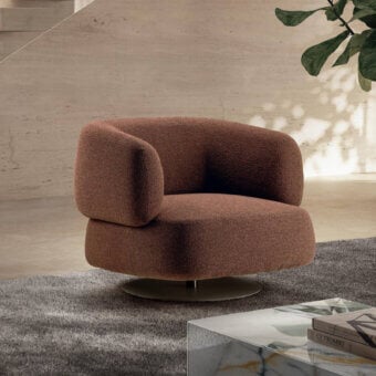 Superior Lago Zeppelin lounge chair with reddish-brown textured textile upholstery and a swivel base built with a return mechanism