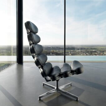 Distinctive Mascheroni Airone lounge chair crafted with smooth black natural leather upholstery and glossy metal base
