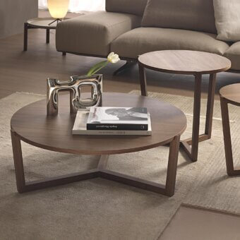 Distinguished Pacini & Cappellini Denny coffee table with a three-legged solid wood structure and veneered wood top in a medium-toned brown finish