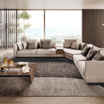 Distinguished Pacini & Cappellini Ester sectional upholstered in light beige woven fabric with a raised wooden base