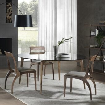 Elegant Pacini & Cappellini Hope table with tinted glass and subtly angled solid wooden legs crafted with a smooth finish