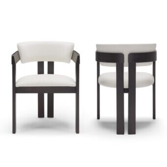 Distinguished Pacini & Cappellini Ines armchair with solid wood structure and light-colored fabric, showcasing a dark matte finish