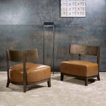Sophisticated Pacini & Cappellini Kandy lounge chair with light-brown upholstered maxi seat and curved solid ash structure