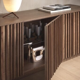 Elegant Pacini & Cappellini Line sideboard with wooden doors and clear glass shelves in a medium brown matte finish