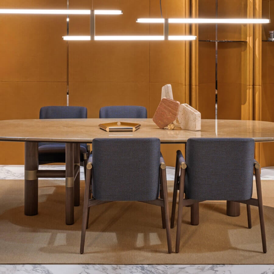 Exceptional Turri Atelier table with walnut wood legs and brass metal inlays, showcasing a light brown stone-patterned oval top