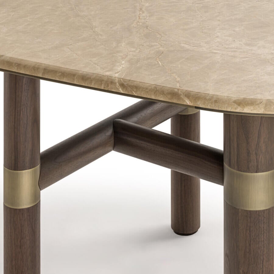 Distinguished Turri Atelier table with walnut legs, brass inlays and a polished beige marbled stone-like top