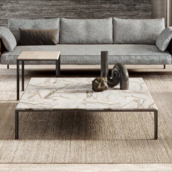 Elegant Turri Ratio coffee table with a patchwork marble top and thin dark metal structure