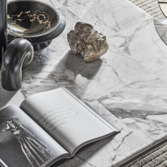 Superior Turri Ratio coffee table with a refined marble top displaying distinctive gray veins and a thin metal structure