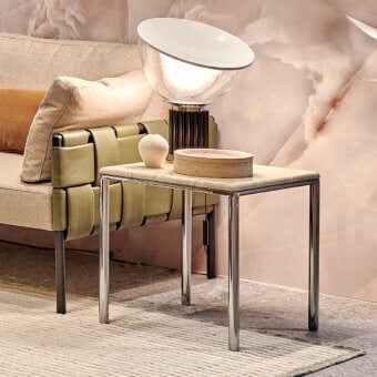 Refined Turri Ratio side table with a glossy metal frame and light beige marble-like surface exhibiting subtle veining