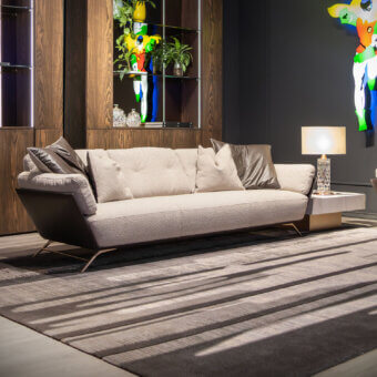 Sophisticated WAYNE Enterprises WE-001 sofa with neutral beige textile upholstery and sleek metal base built with a matte finish