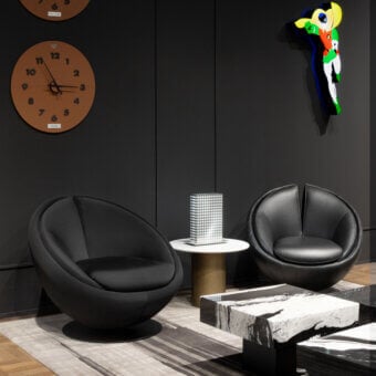 Distinctive WAYNE Enterprises WE-003L lounge chair with sleek black leather upholstery and glossy black metal swivel base