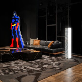 Distinguished WAYNE Enterprises WE-029 sofa in sleek black leather with a wood veneer base and brown cushions