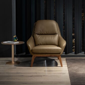 Superior WAYNE Enterprises WE-053 lounge chair upholstered in brown leather with a beautifully grained wood frame