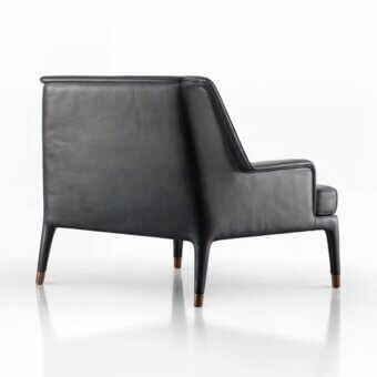 Superior Wayne Enterprises WE-111 lounge chair upholstered in sleek black leather with slender metal feet