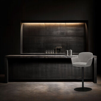 Superior WAYNE Enterprises WE-138 stool upholstered in smooth gray fabric with a dark metal base and circular footrest