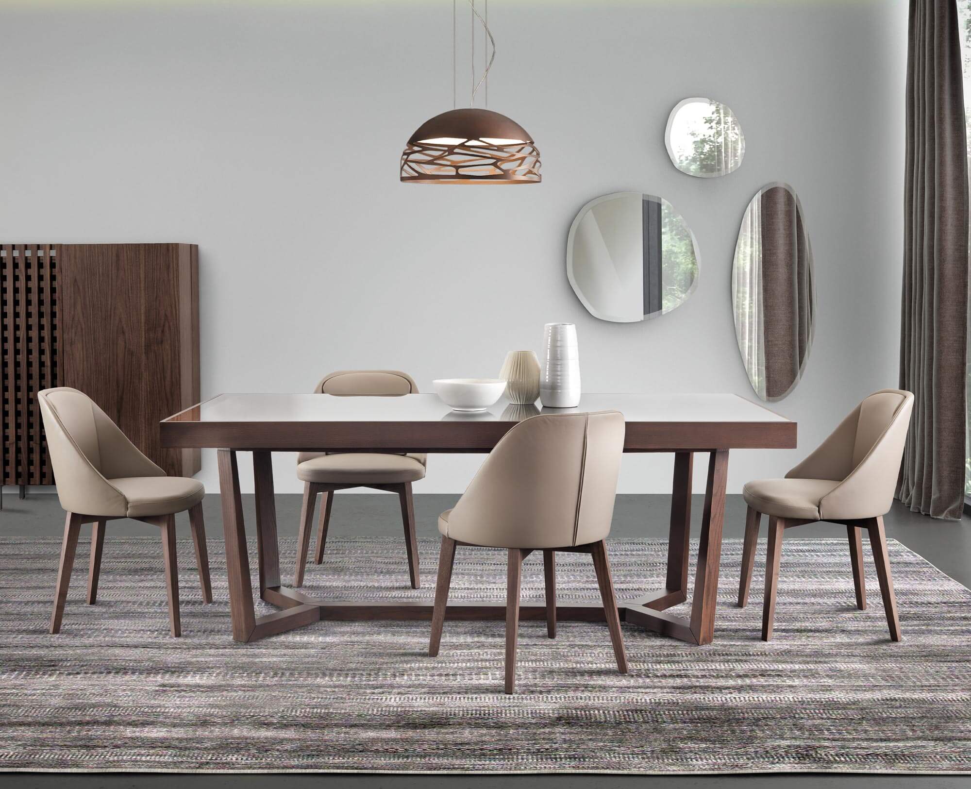 Modern dining room with walnut table and chairs, light gray stone tabletop, woven pendant, ribbed cabinet, and round mirror.