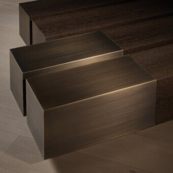 Distinguished Bellavista Courchevel coffee table with dark brown wood base and glossy bronze metallic top crafted in Italy