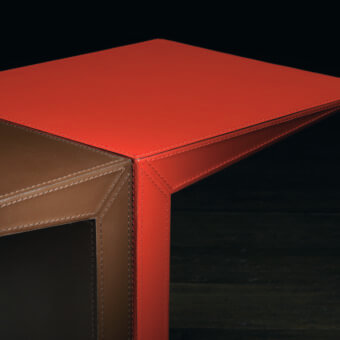 Distinguished Bellavista Franc Paulin side table crafted with reddish-brown saddle-leather and folded metal exhibiting angular lines and detailed stitching