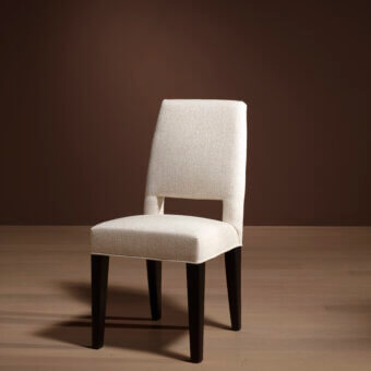 Exceptional Bellavista Margot chair crafted in Italy with light cream fabric upholstery and dark beechwood legs