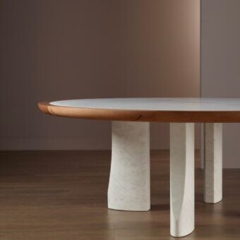 Exceptional Bellavista Michelangelo table built with light marble inset within warm, natural-grain solid oak and curved marble supports