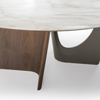 Distinguished Turri Pinnacle table with round marble top and sculptural walnut wood base crafted in dark brown Italian leather