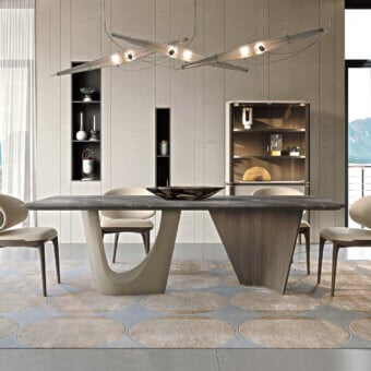 Distinguished Turri Pinnacle table with dark gray marble top and curved light beige with walnut wood base