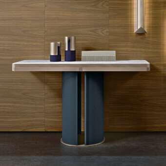Exclusive Turri Zero console with light-colored top and dark blue cylindrical base clad in Italian leathers with platinum accents and glossy lacquered wood